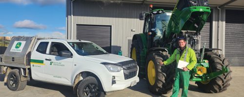 John Deere Service Technician fixing tractor